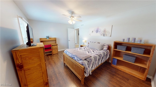 bedroom featuring dark wood-style floors, baseboards, and ceiling fan