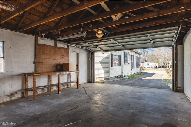 garage with concrete block wall