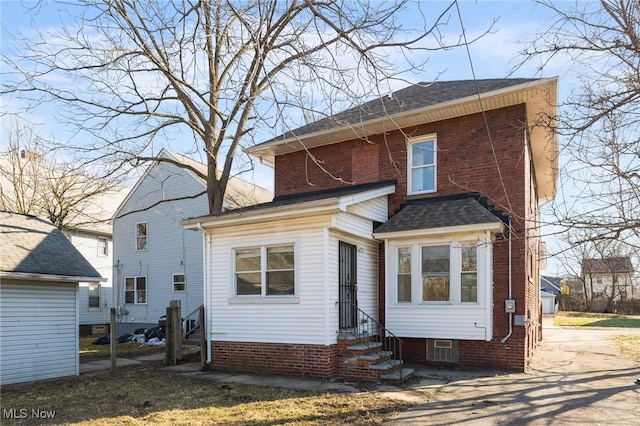 back of house featuring entry steps