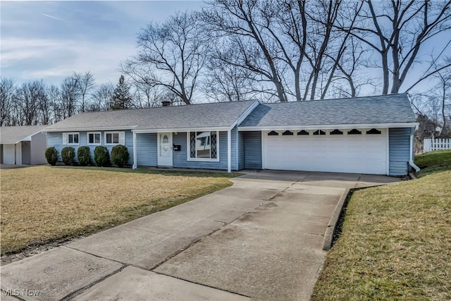 single story home featuring a front lawn, an attached garage, concrete driveway, and a shingled roof