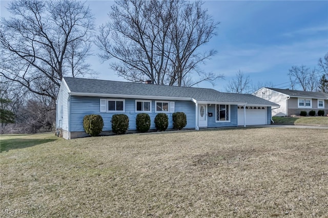 ranch-style house featuring driveway, a front lawn, an attached garage, and a shingled roof