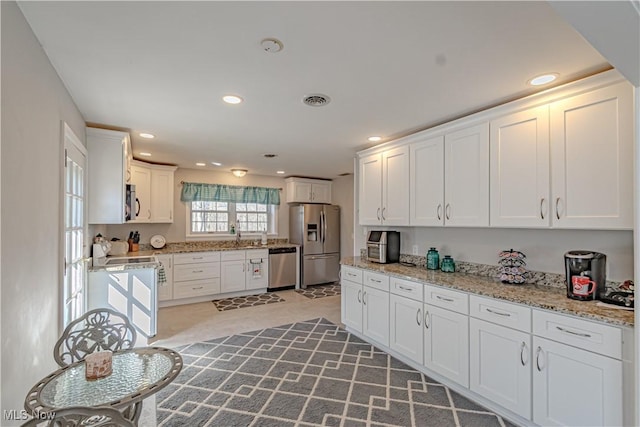 3164 Old Weymouth Rd, Medina, OH 44256 - kitchen featuring white cabinets, visible vents, stainless steel appliances, recessed lighting, and light stone counters