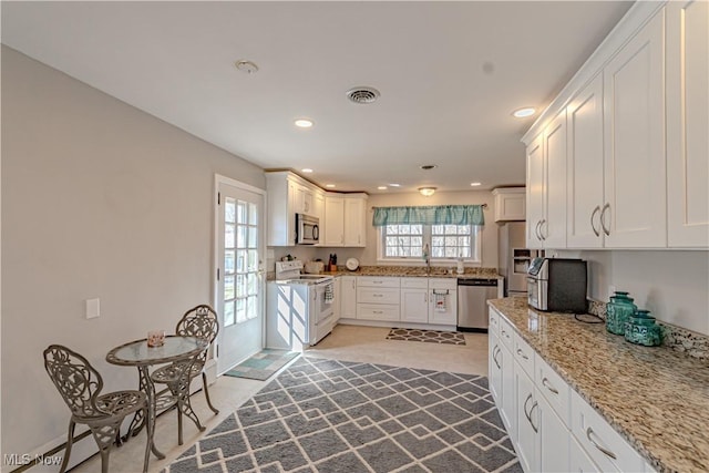 3164 Old Weymouth Rd, Medina, OH 44256 - kitchen with white cabinetry, visible vents, and stainless steel appliances