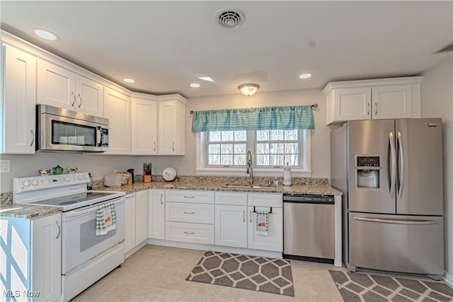 3164 Old Weymouth Rd, Medina, OH 44256 - kitchen with white cabinetry, a sink, appliances with stainless steel finishes, and visible vents