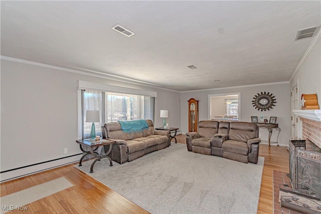 3164 Old Weymouth Rd, Medina, OH 44256 - living room featuring visible vents, crown molding, light wood-style flooring, and a fireplace