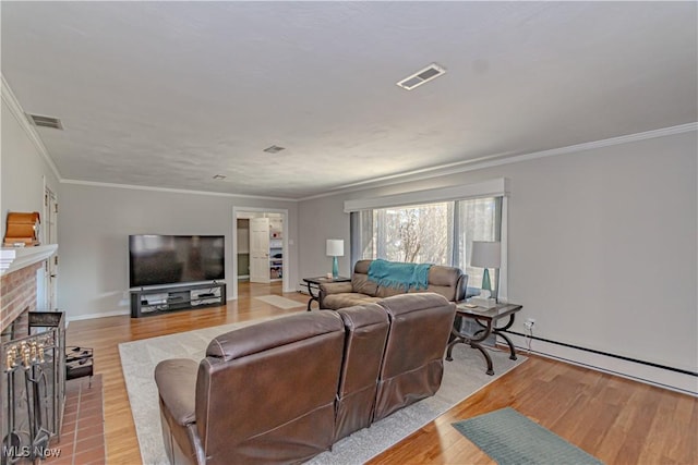 3164 Old Weymouth Rd, Medina, OH 44256 - living area with light wood finished floors, visible vents, crown molding, and a brick fireplace