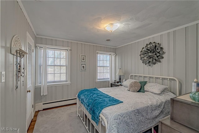 3164 Old Weymouth Rd, Medina, OH 44256 - bedroom featuring baseboard heating, crown molding, and wood finished floors