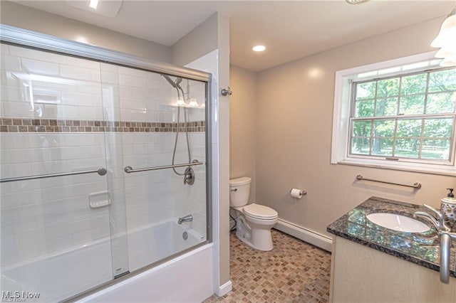 3164 Old Weymouth Rd, Medina, OH 44256 - bathroom featuring baseboards, toilet, vanity, a baseboard heating unit, and enclosed tub / shower combo