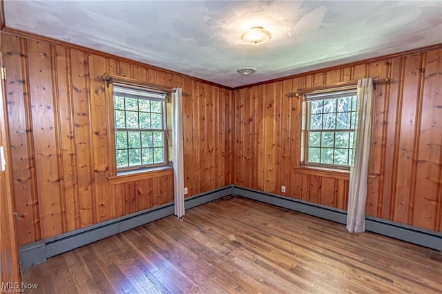 3164 Old Weymouth Rd, Medina, OH 44256 - unfurnished room featuring wooden walls, ornamental molding, and wood-type flooring