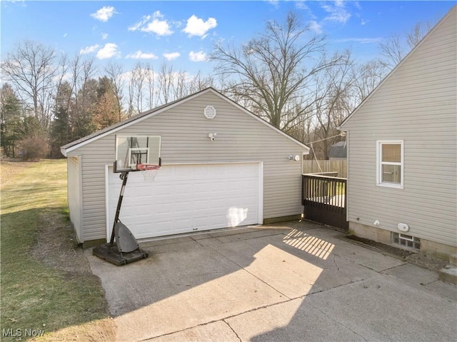 detached garage featuring fence