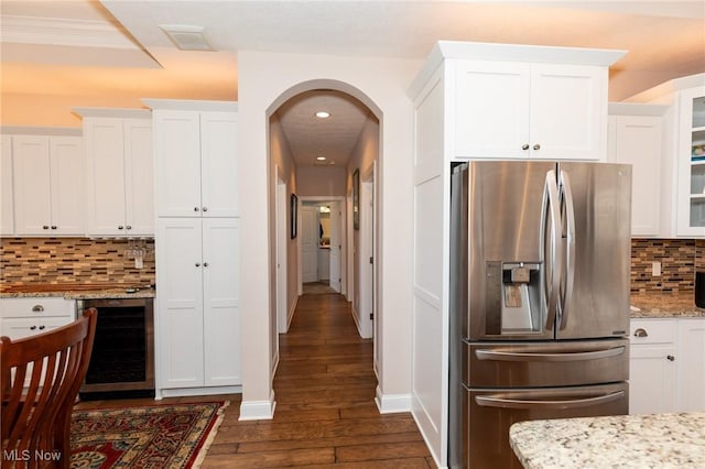 kitchen featuring dark wood-style floors, beverage cooler, white cabinets, and stainless steel fridge with ice dispenser