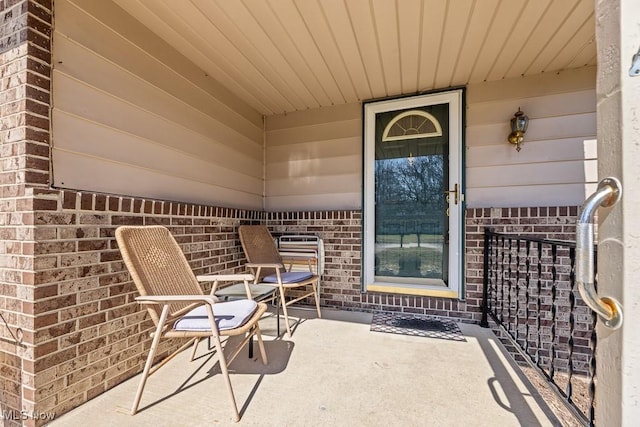 property entrance with brick siding