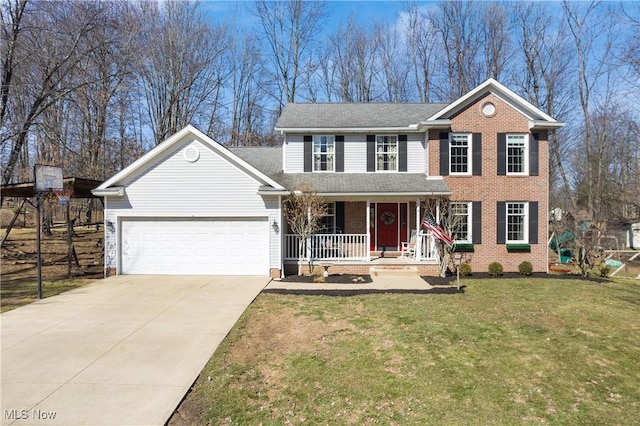 view of front of home with driveway, an attached garage, covered porch, a front lawn, and brick siding