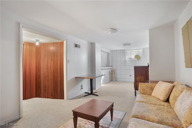 carpeted living area with visible vents