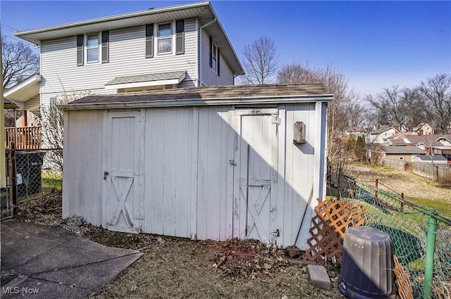 view of shed with fence