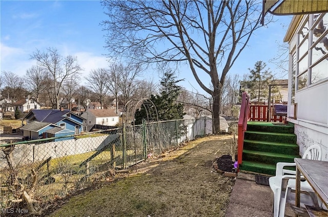 view of yard with a residential view and a fenced backyard