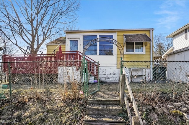 rear view of property featuring fence