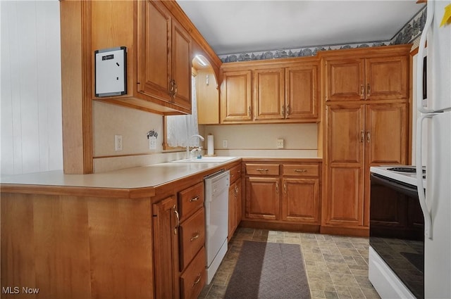 kitchen with white appliances, brown cabinetry, light countertops, and a sink