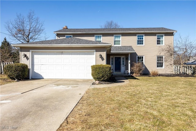 view of front of property with a garage, driveway, and a front yard