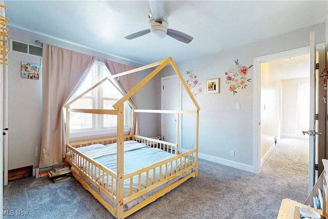 carpeted bedroom featuring baseboards, visible vents, and ceiling fan