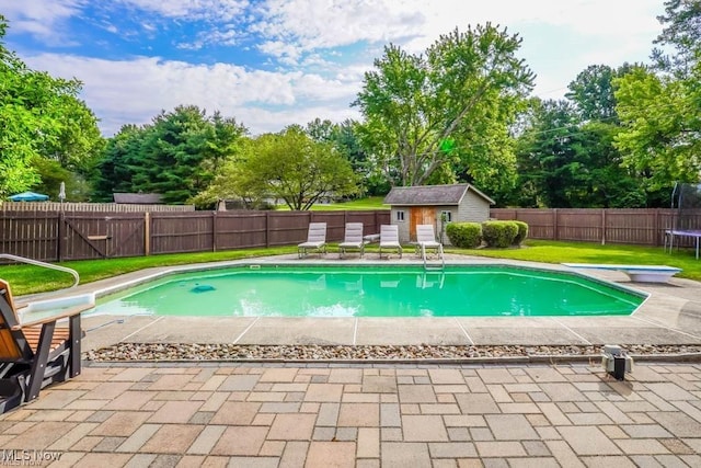 view of swimming pool with a fenced in pool, a patio, a trampoline, and a fenced backyard