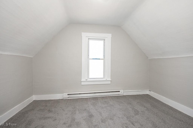 bonus room featuring vaulted ceiling, carpet floors, baseboards, and a baseboard radiator