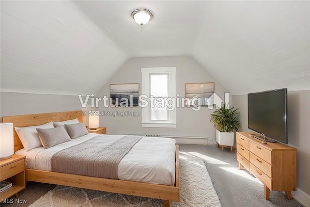 carpeted bedroom featuring vaulted ceiling, baseboards, and a baseboard radiator