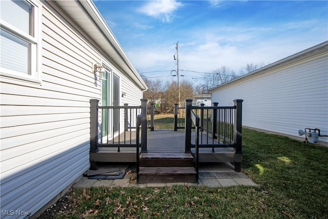 wooden terrace with a yard