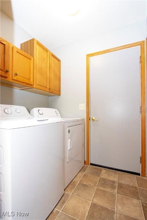 laundry area featuring cabinet space and washer and clothes dryer