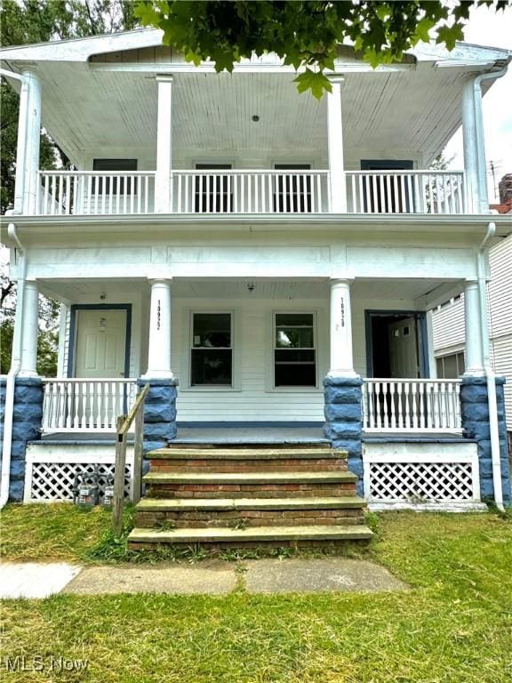 view of front of home featuring a porch and a balcony