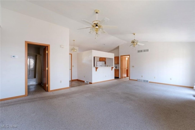 unfurnished living room with light colored carpet, visible vents, and ceiling fan