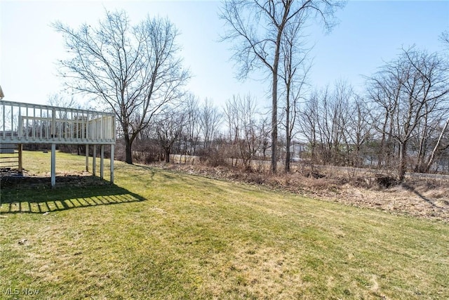 view of yard featuring a wooden deck