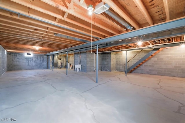 unfinished basement featuring a sink