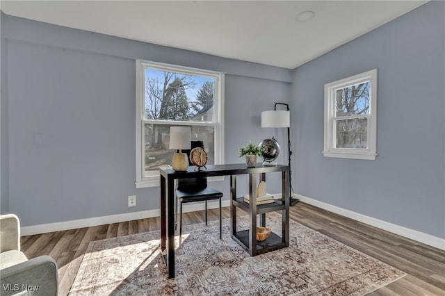 office area with baseboards and wood finished floors