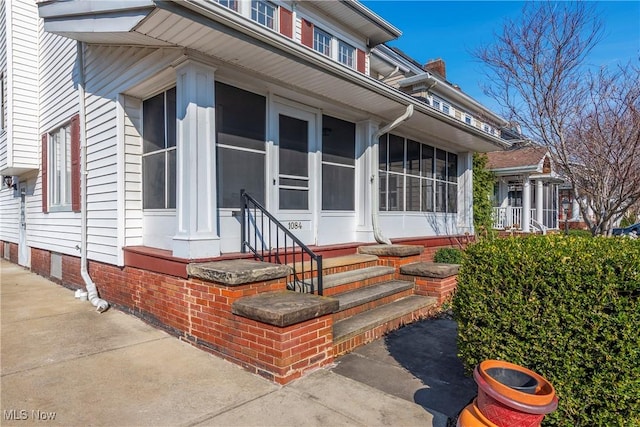 exterior space featuring entry steps and a sunroom