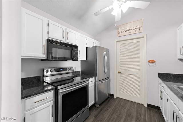 kitchen with a ceiling fan, dark stone countertops, stainless steel appliances, white cabinets, and dark wood-style flooring