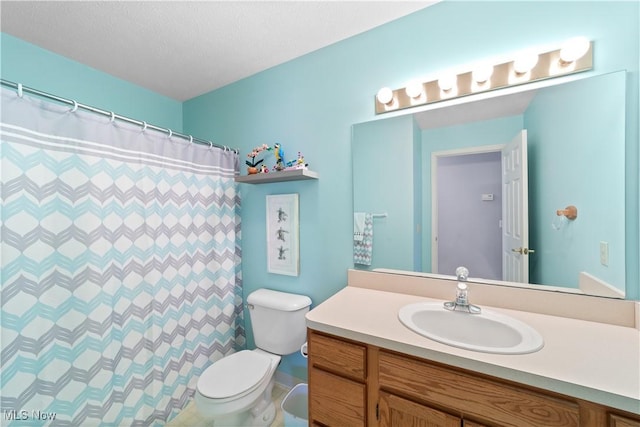 bathroom with a shower with curtain, toilet, and vanity