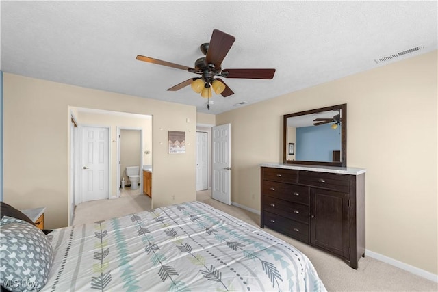 bedroom featuring visible vents, light colored carpet, baseboards, and ceiling fan