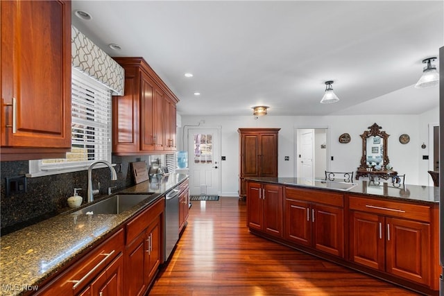 kitchen with dishwasher, a wealth of natural light, and a sink