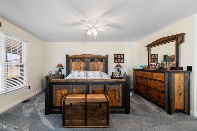 bedroom featuring dark carpet, baseboards, and ceiling fan
