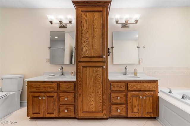 bathroom featuring toilet, a bath, vanity, and tile patterned flooring