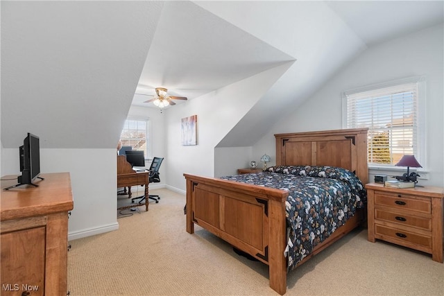 bedroom with ceiling fan, light colored carpet, baseboards, and lofted ceiling