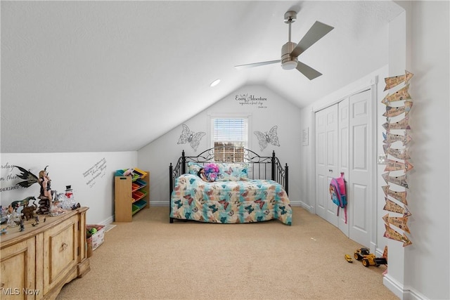 bedroom with baseboards, a closet, a ceiling fan, carpet floors, and lofted ceiling