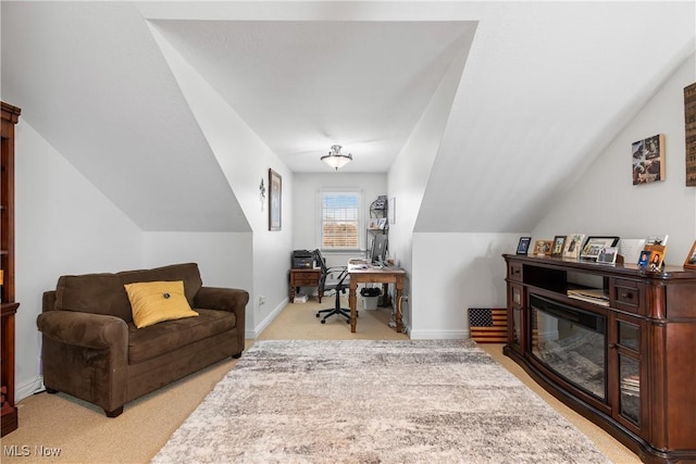 office area featuring lofted ceiling, carpet, and baseboards