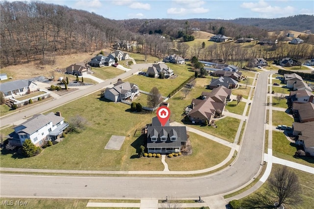 birds eye view of property with a residential view