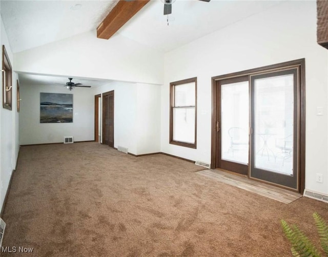 unfurnished living room with lofted ceiling with beams, visible vents, carpet floors, and ceiling fan