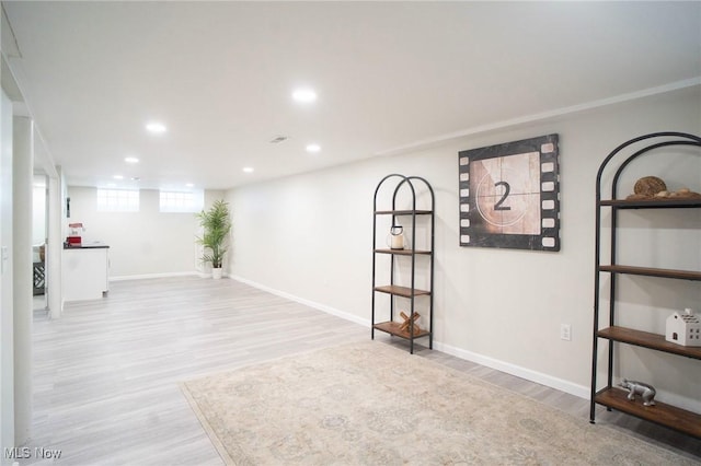 basement with recessed lighting, baseboards, and wood finished floors