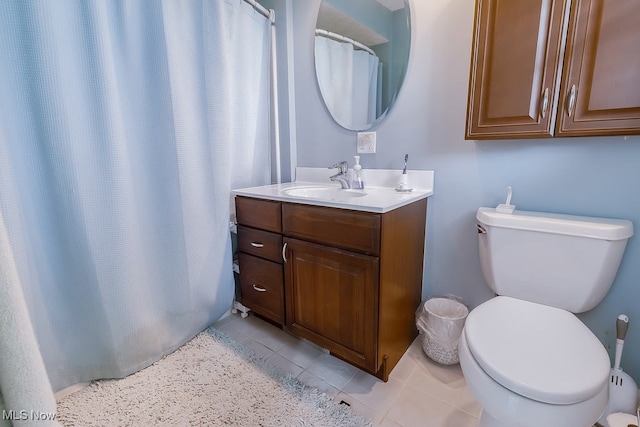 full bathroom with tile patterned flooring, toilet, vanity, and a shower with curtain