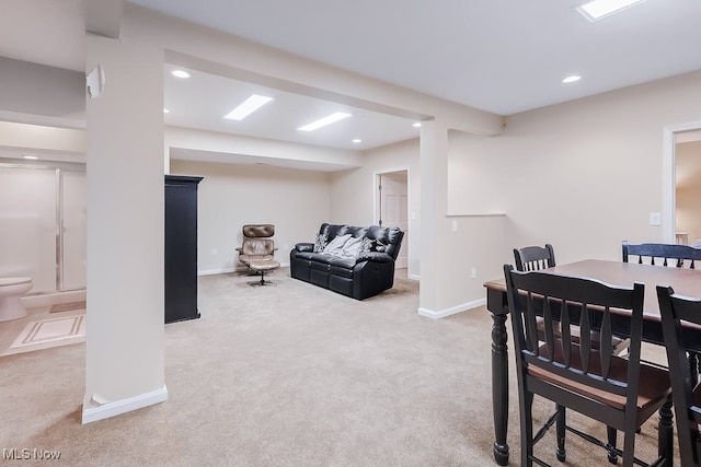 carpeted dining room with recessed lighting and baseboards