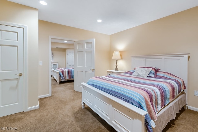 bedroom featuring recessed lighting, baseboards, and light colored carpet